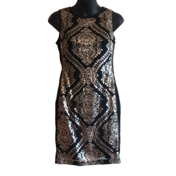 Black and gold( sequins) on this fancy little dress by Donna Ricco.size 2p - Picture 1 of 15